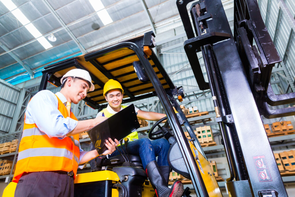 Forklift Operator on Site talking to a colleague